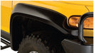 Close-up of yellow truck with black bumper for bushwacker toyota fj cruiser flares