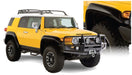 Yellow toyota fj cruiser with black bumper - bushwacker extend-a-fender style flares