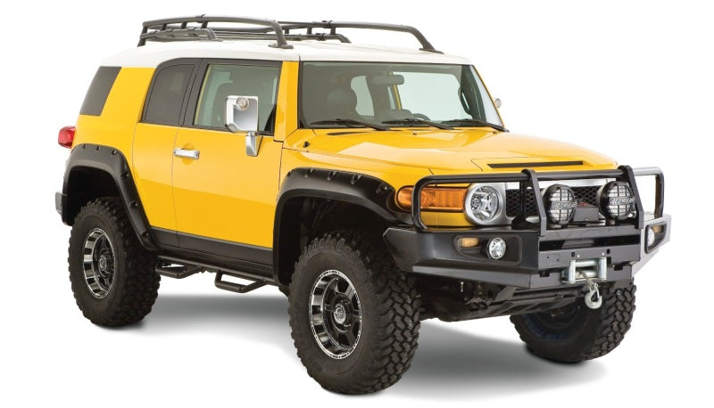 Yellow toyota fj cruiser with pocket style fender flares - black