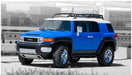 Blue and white toyota fj cruiser with pocket style fender flares - black