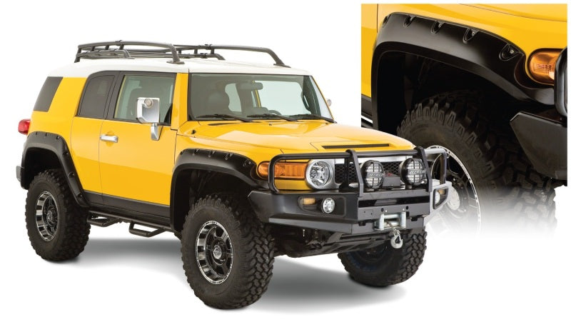 Yellow toyota fj cruiser with black bumper and pocket style fender flares