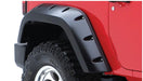 Red jeep wrangler with black tire cover - bushwacker pocket style fender flares