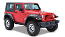 Red jeep wrangler with black pocket style fender flares and white wheels by bushwacker