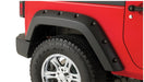 Red jeep wrangler with black bumper pocket style fender flares