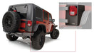 Rear view of a jeep wrangler with open rear door - bushwacker trail armor corners in black