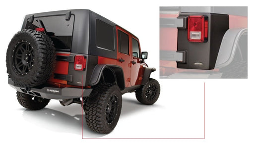 Rear view of a jeep wrangler with open rear door - bushwacker trail armor corners in black