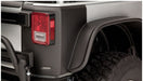 Black truck with red tail light - bushwacker jeep wrangler trail armor rear corners