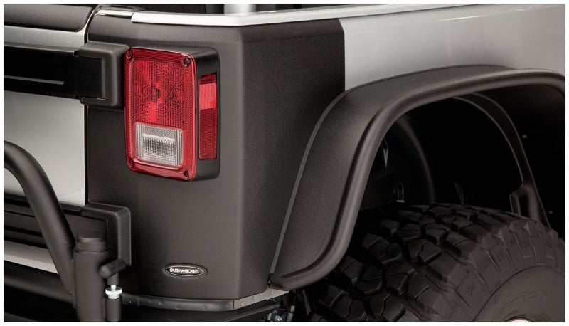 Black truck with red tail light - bushwacker jeep wrangler trail armor rear corners