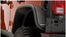 Close up of rear bumper on bushwacker 07-18 jeep wrangler unlimited flat style fender flares - black