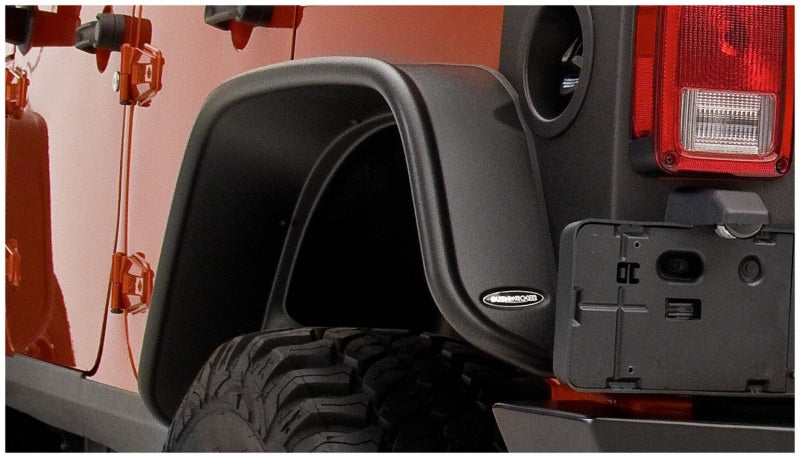 Close up of rear bumper on bushwacker 07-18 jeep wrangler unlimited flat style fender flares - black