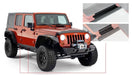 Red jeep wrangler unlimited with black bumper - trail armor sill plate cover