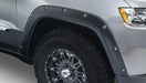 Gray truck front end with bushwacker pocket style fender flares for jeep grand cherokee