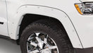 White truck with black rim and chrome wheels showcasing bushwacker jeep grand cherokee pocket style fender flares