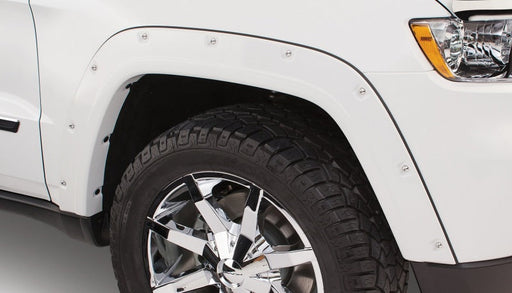 White truck with black rim and chrome wheels showcasing bushwacker jeep grand cherokee pocket style fender flares
