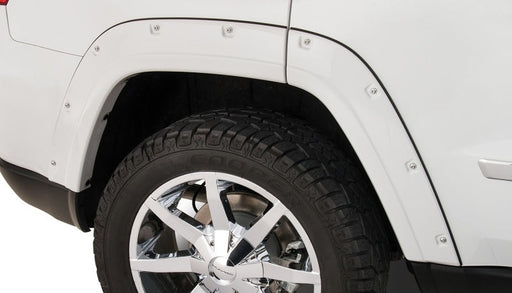 White truck with black tire cover - bushwacker pocket style fender flares for jeep grand cherokee