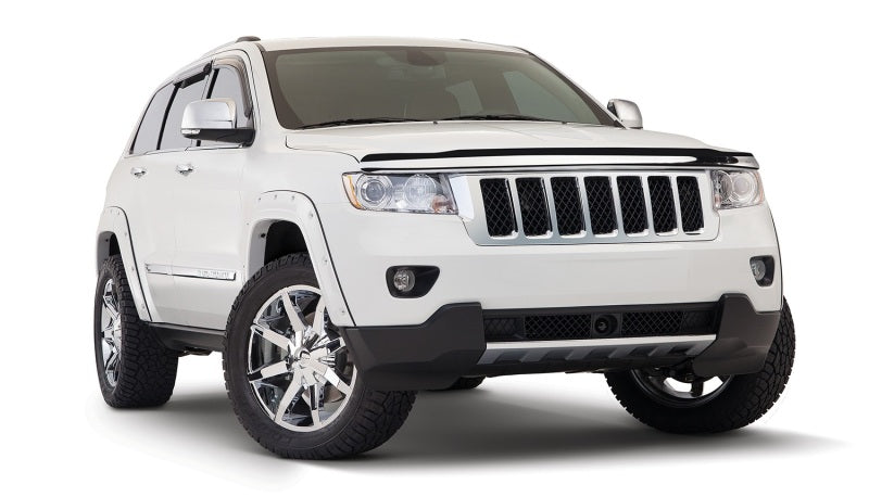 White jeep grand cherokee with pocket style fender flares on white background