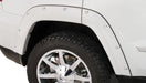 White truck with black tire featuring bushwacker pocket style fender flares for jeep grand cherokee