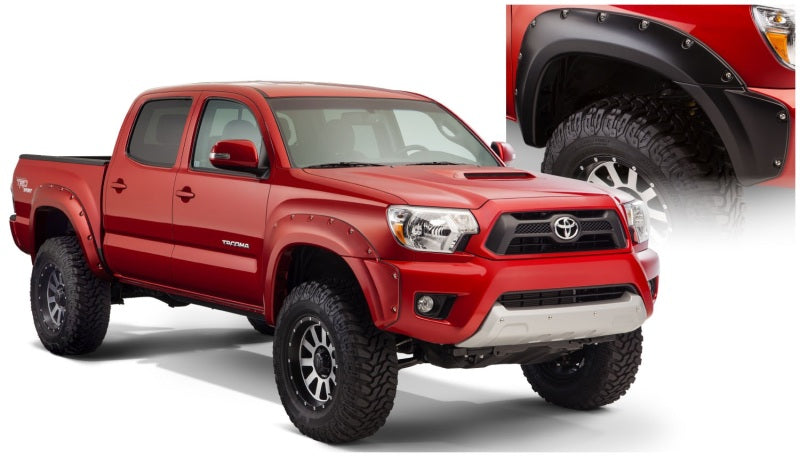 Red truck with black bumper against white background - bushwacker toyota tacoma pocket style fender flares