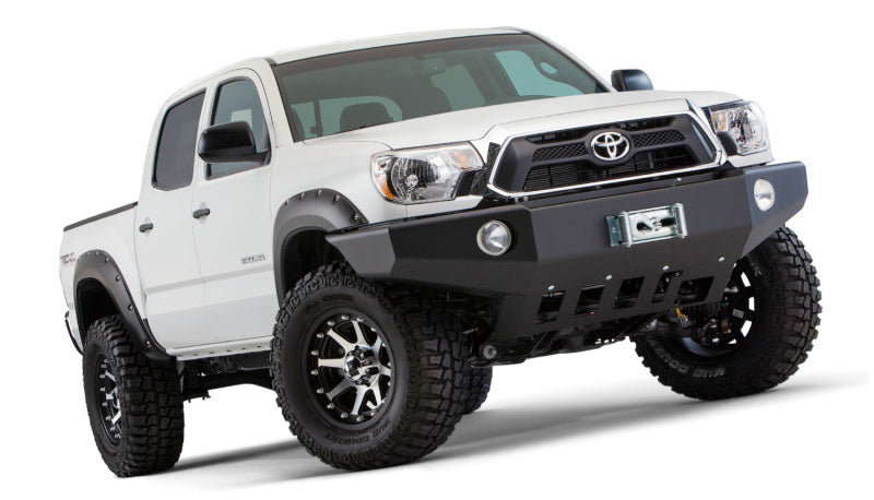 White toyota tacoma with pocket style fender flares in black