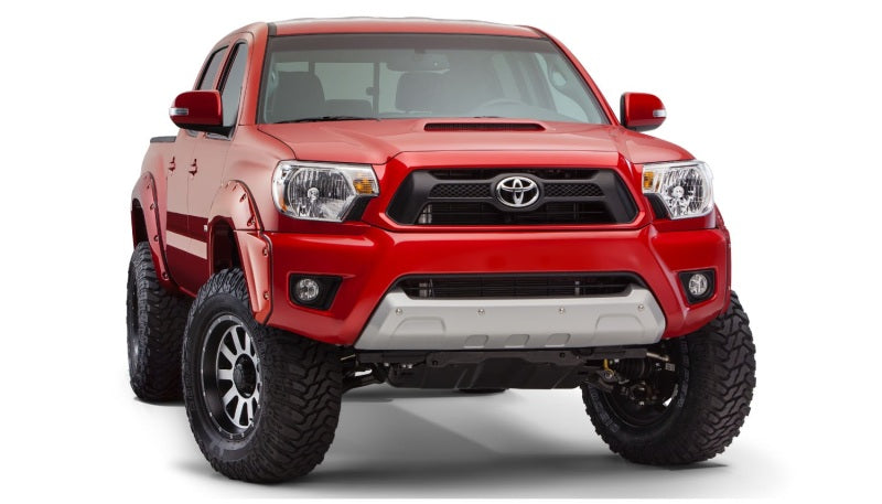 Red toyota tacoma with pocket style fender flares