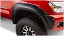 Red truck with black fender showcasing bushwacker toyota tacoma pocket style fender flares