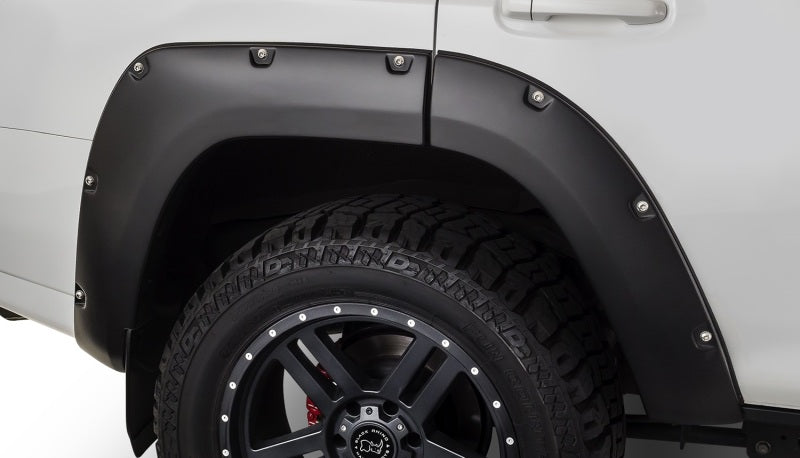 White truck with black wheels and tire, bushwacker toyota 4runner pocket style flares in black