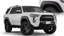 White toyota 4runner with black wheels - bushwacker pocket style flares