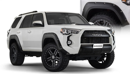 White toyota 4runner with black wheels - bushwacker pocket style flares