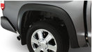 Black toyota tundra fleetside fender flares with tire cover on truck