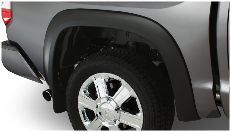 Black toyota tundra fleetside fender flares with tire cover on truck