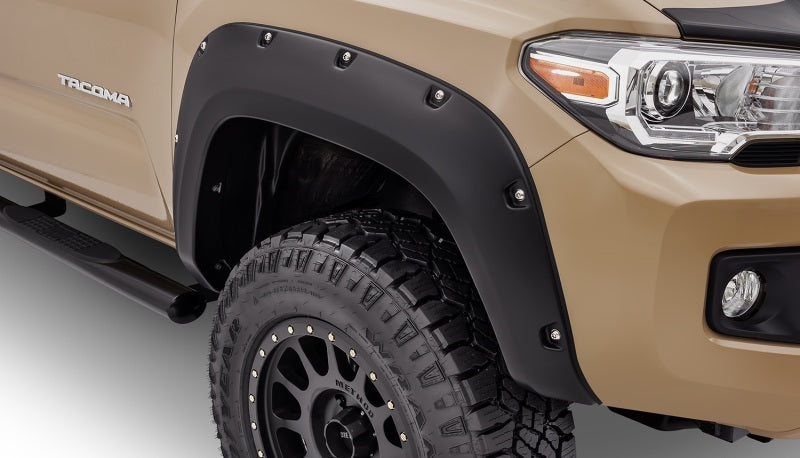 Black pocket style fender flares on toyota tacoma truck