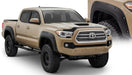 Tan toyota tacoma with black bumper - bushwacker pocket style fender flares