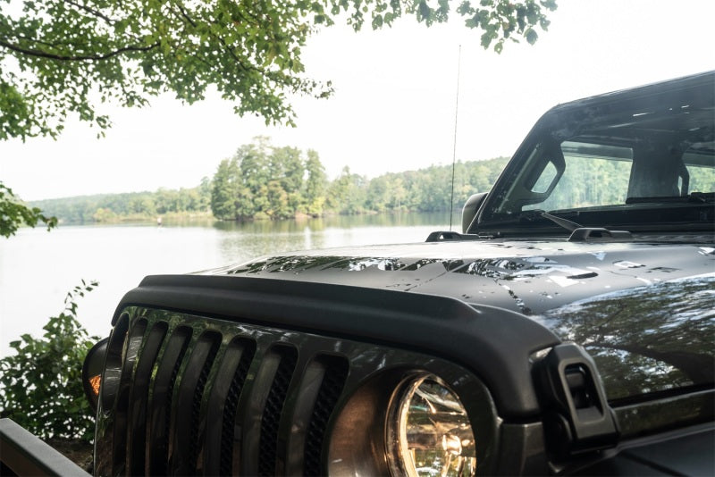 Black bushwacker 18-19 jeep wrangler rubicon parked on side of road