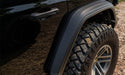 Bushwacker 18-21 jeep wrangler hyperform fender flares - front end of black jeep with tire