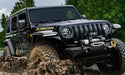 Bushwacker 18-21 jeep wrangler jl hyperform fender flares driving through mud in black - 4pc