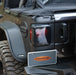 Black jeep with a black backpack on trailarmor rear corner guard