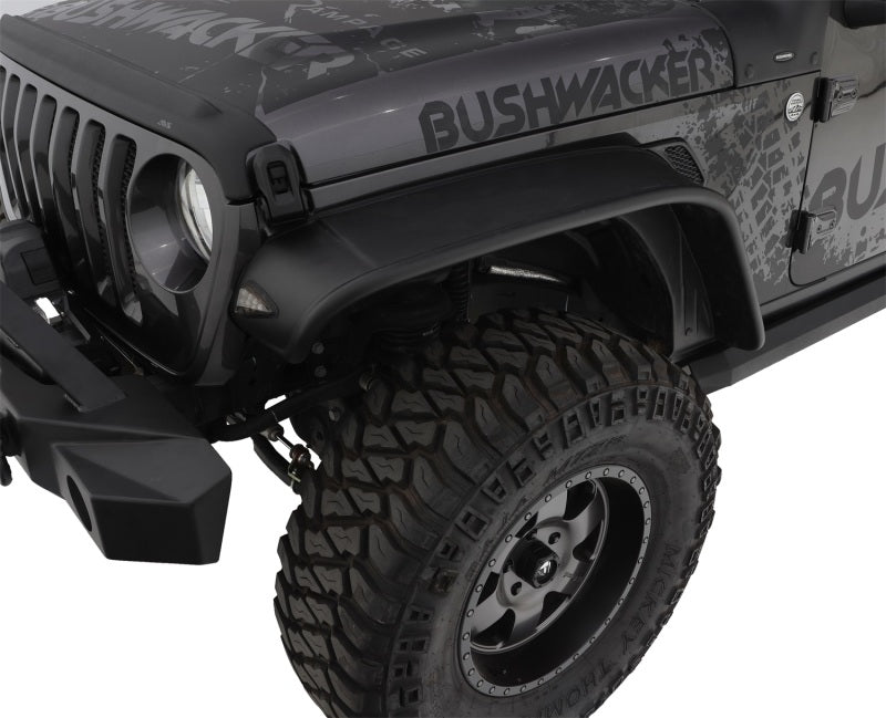 Black jeep wrangler unlimited with flat style fender flares and tire cover