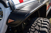 White and red truck with black tire featuring bushwacker 2020 jeep gladiator launch edition flat style flares