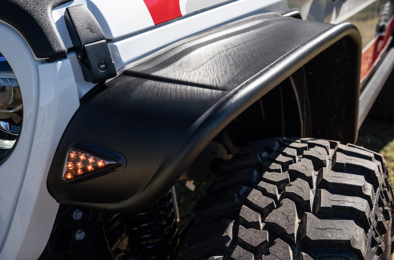 White and red truck with black tire featuring bushwacker 2020 jeep gladiator launch edition flat style flares
