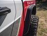 Front end of red and white truck with flat style fender flares by bushwacker