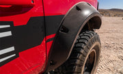 Red truck with black tire cover featuring bushwacker 2021+ ford bronco 4-door pocket style fender flares