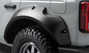 Bushwacker 2021+ ford bronco 4-door pocket style flares - black truck with large tire on back