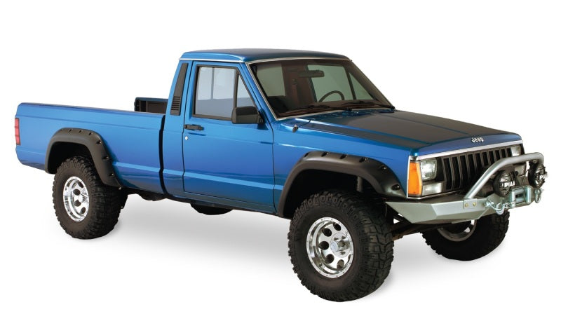 Blue truck with black bumper displayed in bushwacker fender flares for jeep cherokee