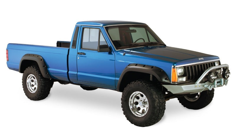 Blue truck with black bumper featuring bushwacker 84-01 jeep cherokee cutout style flares