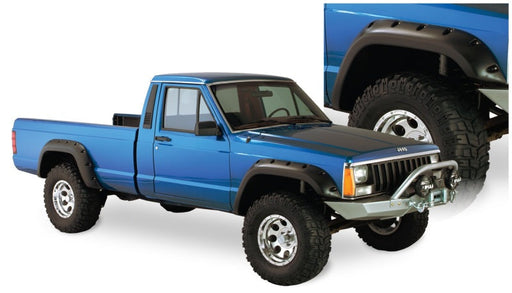 Blue truck with black bumper against white background - bushwacker jeep cherokee cutout style fender flares