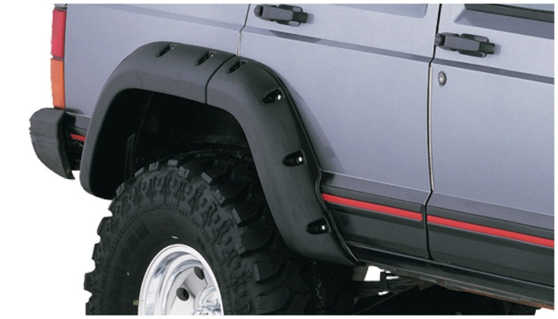 Black jeep cherokee with white tire cover - bushwacker fender flares for 4-door sport utility vehicle