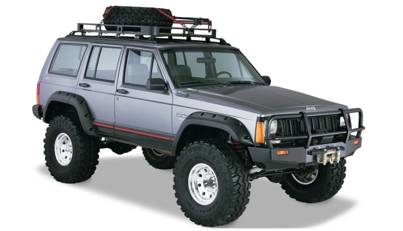 Black jeep cherokee with roof rack and top rack - bushwacker 84-01 cutout style flares - fender flares for ford bronco