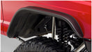 Bushwacker flat style fender flares on red jeep front bumper