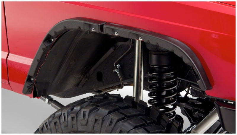 Close-up of bushwacker 84-01 jeep cherokee flat style fender flares - black