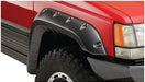 Red truck with black bumper on white background - bushwacker jeep grand cherokee fender flares 4pc in black